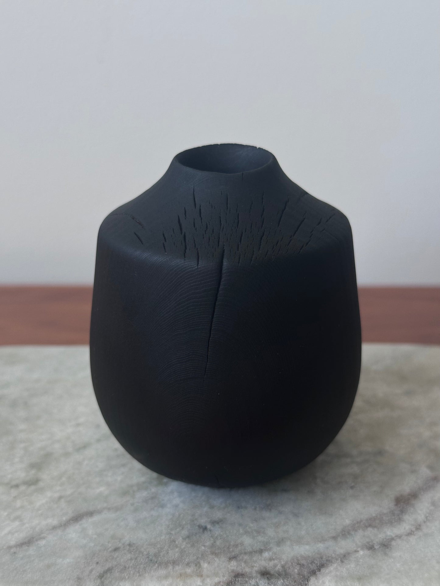 small charred vase